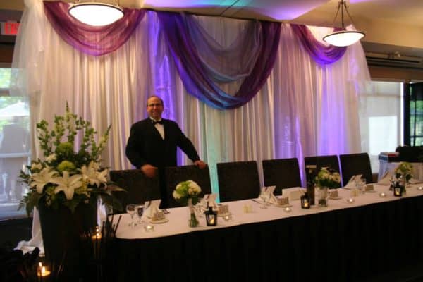 Wedding DJ performing with lights and fog 